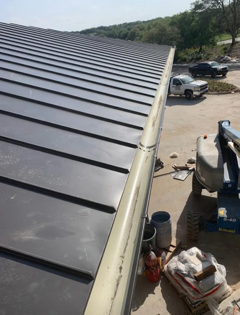 Standing seam panel and gutter detail on a metal roofing jobsite in El Cerrito